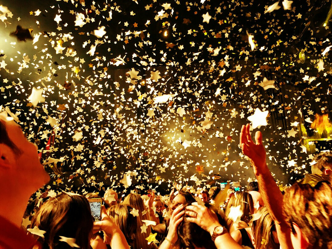 Concert with confetti and colorful lights